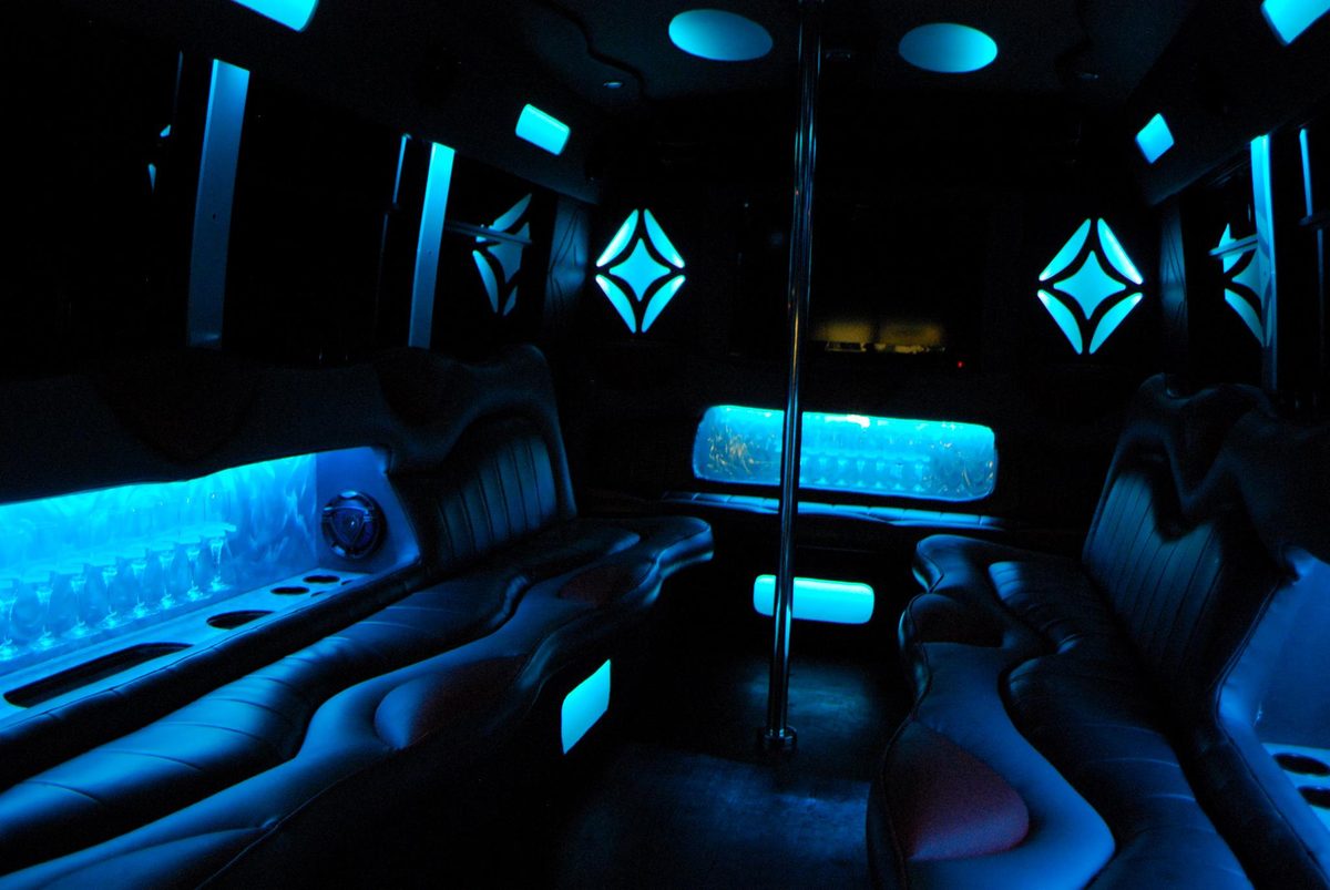 Party bus interior with blue ambient lighting